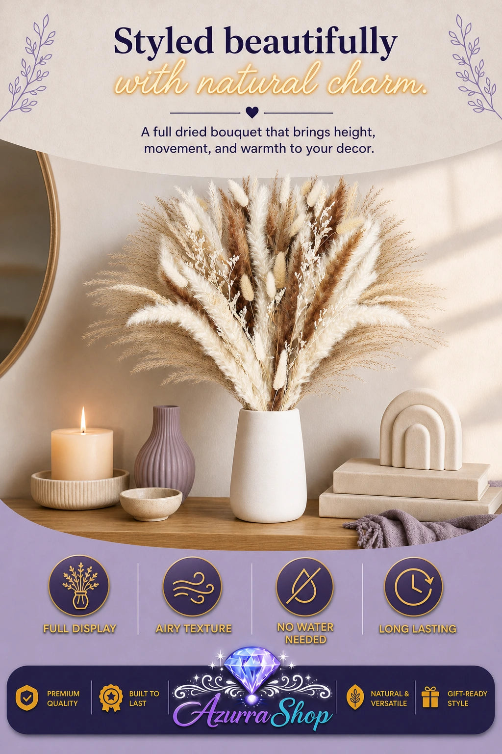 Dried pampas grass bouquet in a white vase styled on a wooden console table with a lit candle, small bud vase, decorative bowl, and arch shaped decor accent