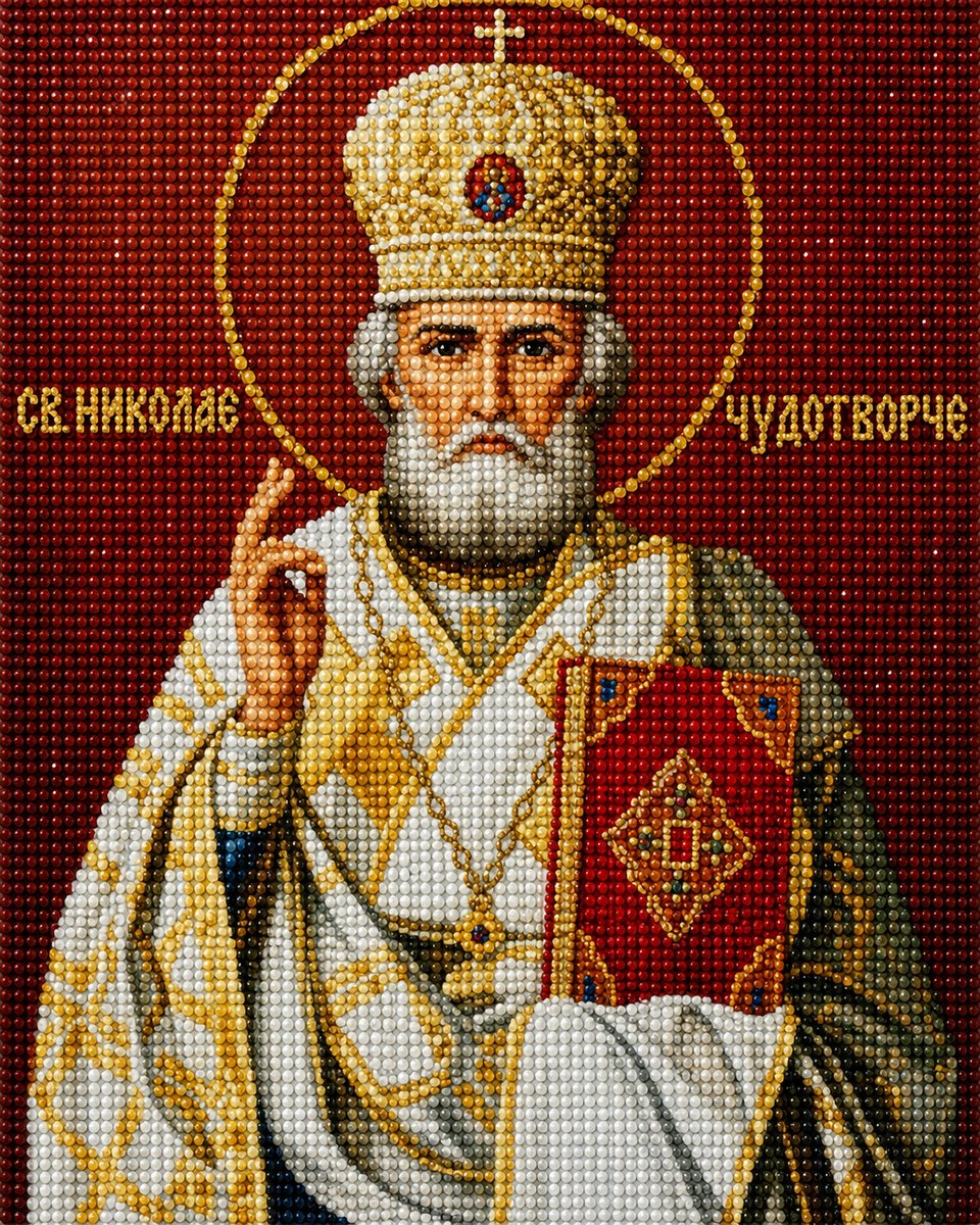 Close up of the finished Saint Nicholas diamond painting, in gold and white vestments with a golden halo