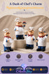 All four hand-painted resin chef figurines (styles A, B, C, and D) grouped together on a display pedestal against a soft beige backdrop