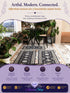 Three coordinated dark patterned rugs displayed in a bright plant-filled entryway, with an Azurra Shop promotional banner