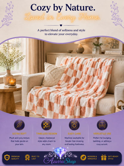 Pink and white checkerboard fleece throw blanket draped over a beige armchair in a living room, with an Azurra Shop promotional banner