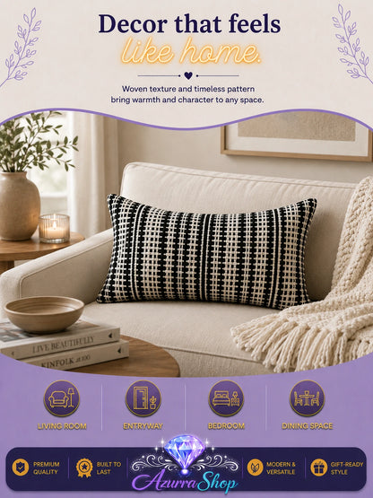 Black and white houndstooth-patterned pillow styled on a cream armchair in a modern living room