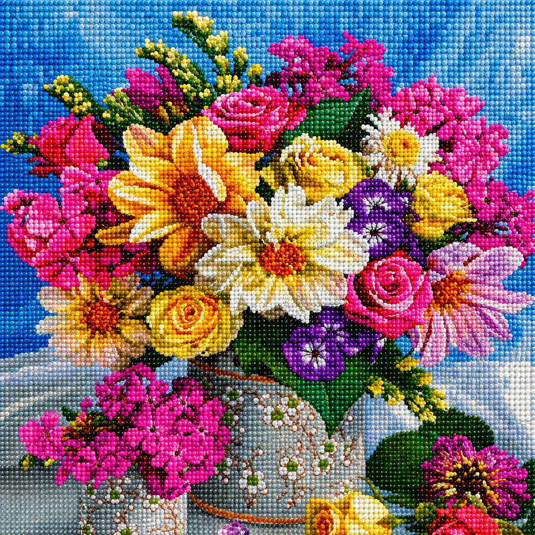 Finished vibrant mixed floral bouquet diamond painting with colorful daisies roses and pansies in a vase against a blue sky | Azurra Shop
