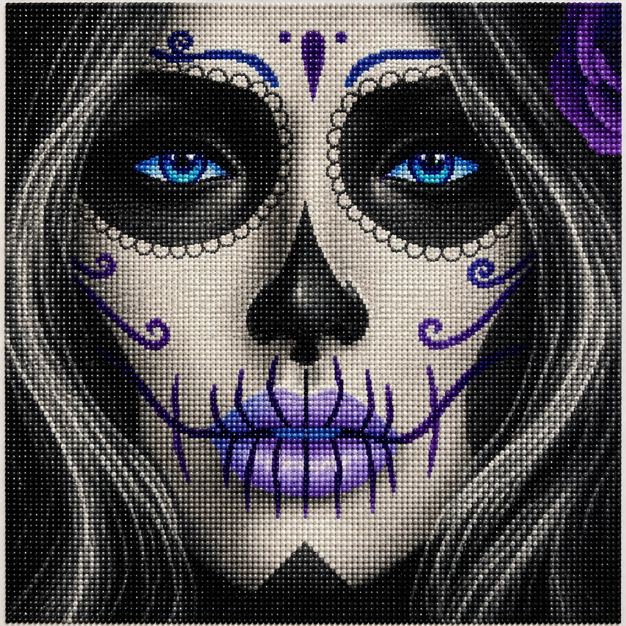 Blue-Eyed Sugar Skull Woman Diamond Painting Kit – completed 5D diamond art close-up featuring a hauntingly beautiful woman with white face paint, glowing electric blue eyes, intricate purple swirl designs on cheeks, pearl-beaded scalloped eye circles, blue teardrop and dot forehead ornament, black hollow nose, and lavender and purple stitched jaw pattern with flowing dark hair and a purple rose on a black background
