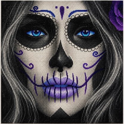 Blue-Eyed Sugar Skull Woman Diamond Painting Kit – completed 5D diamond art close-up featuring a hauntingly beautiful woman with white face paint, glowing electric blue eyes, intricate purple swirl designs on cheeks, pearl-beaded scalloped eye circles, blue teardrop and dot forehead ornament, black hollow nose, and lavender and purple stitched jaw pattern with flowing dark hair and a purple rose on a black background
