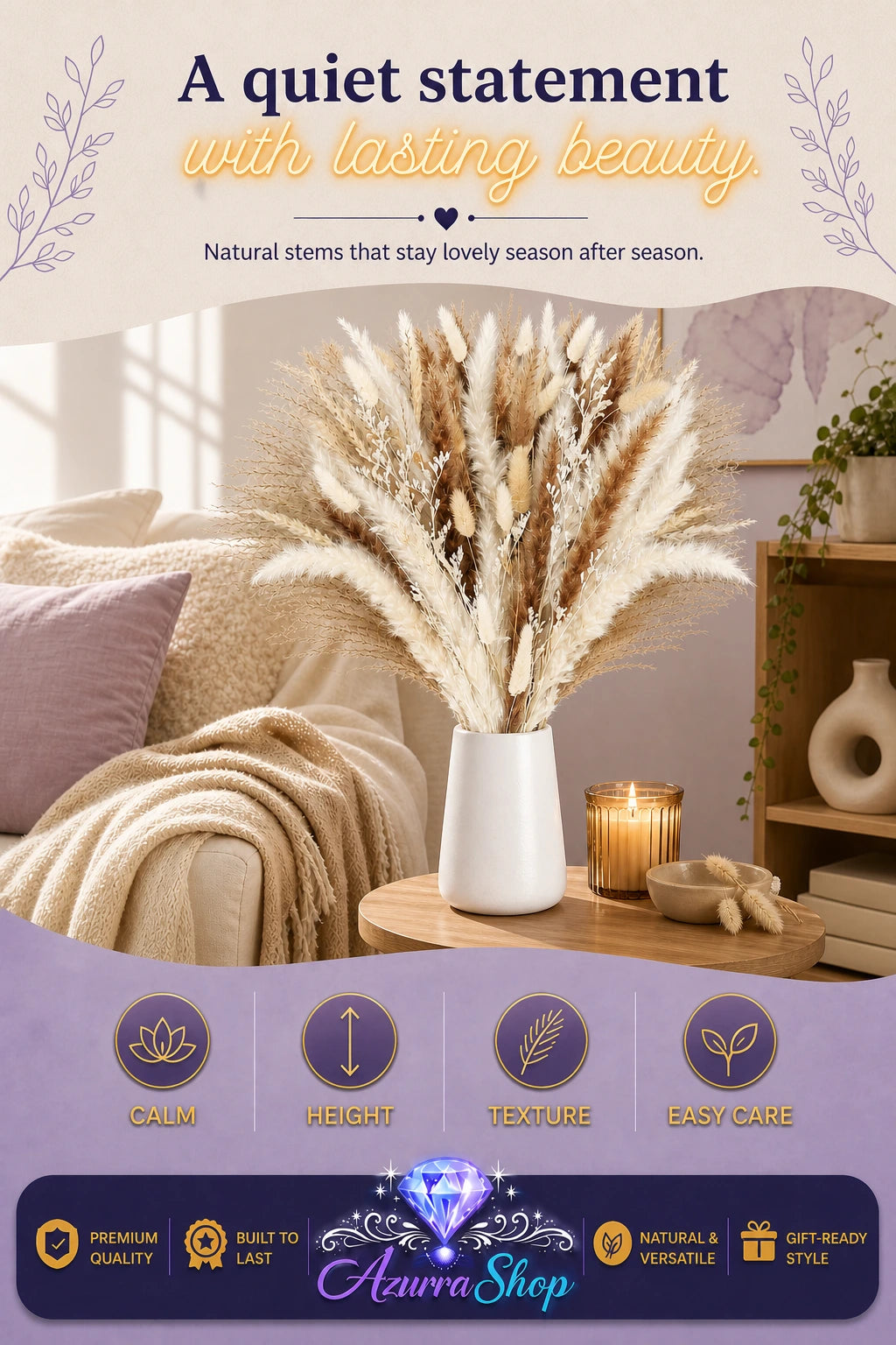 Dried pampas grass bouquet in a white vase on a wooden side table beside a cozy sofa with cream blankets and pillows, with a lit candle and small vase nearby
