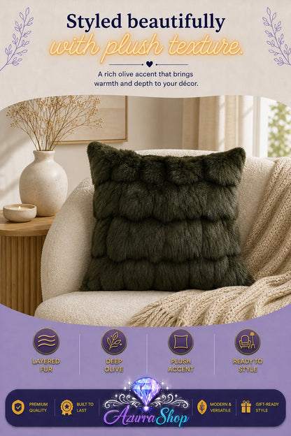 Dark olive green faux-fur throw pillow styled on a cream armchair with a beige knit blanket; promotional text reads "Styled beautifully with plush texture."