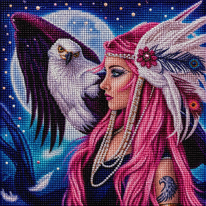 Finished diamond painting of a pink haired woman in a feather headdress face to face with a bald eagle under a full moon | Azurra Shop
