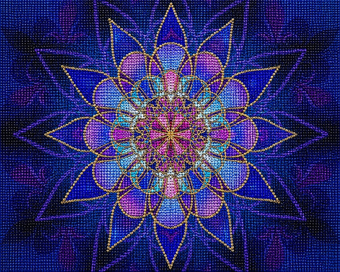 Finished blue stained glass lotus mandala diamond painting with cobalt blue star petals and a pink and teal center | Azurra Shop