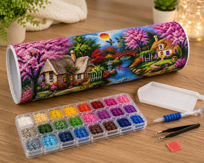Rolled panoramic canvas and supplies for the cherry blossom river cottage kit, including drill organizer, applicator pen, and tweezers | Azurra Shop