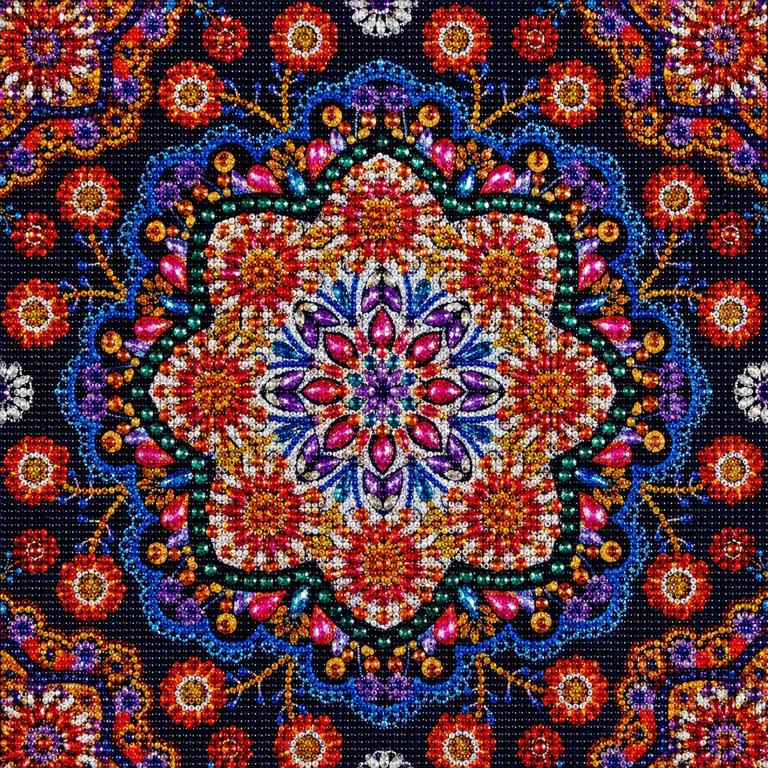 Finished crimson jeweled flower mandala diamond painting with a red and blue floral medallion surrounded by scattered flowers on navy | Azurra Shop