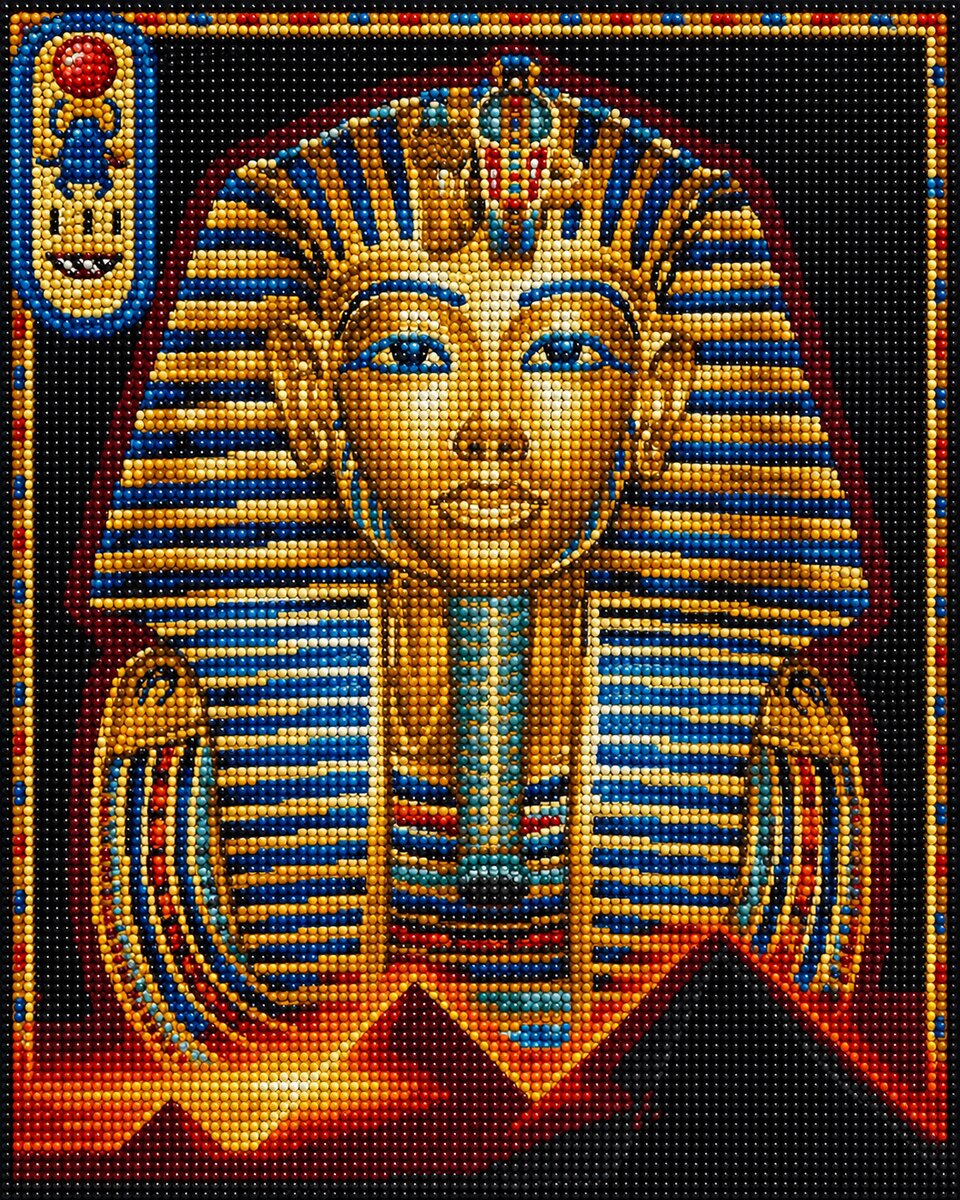 Close up of the finished Egyptian pharaoh diamond painting with a gold and blue striped headdress and a pyramid backdrop | Azurra Shop