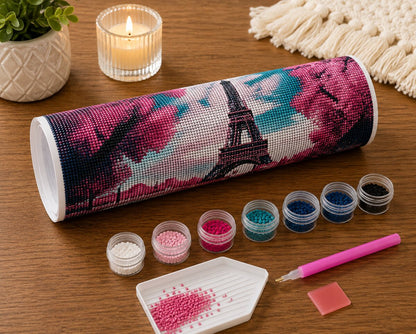 Rolled canvas and full supplies for the Eiffel Tower cherry blossom kit, including diamond packets, applicator pen, and tray | Azurra Shop