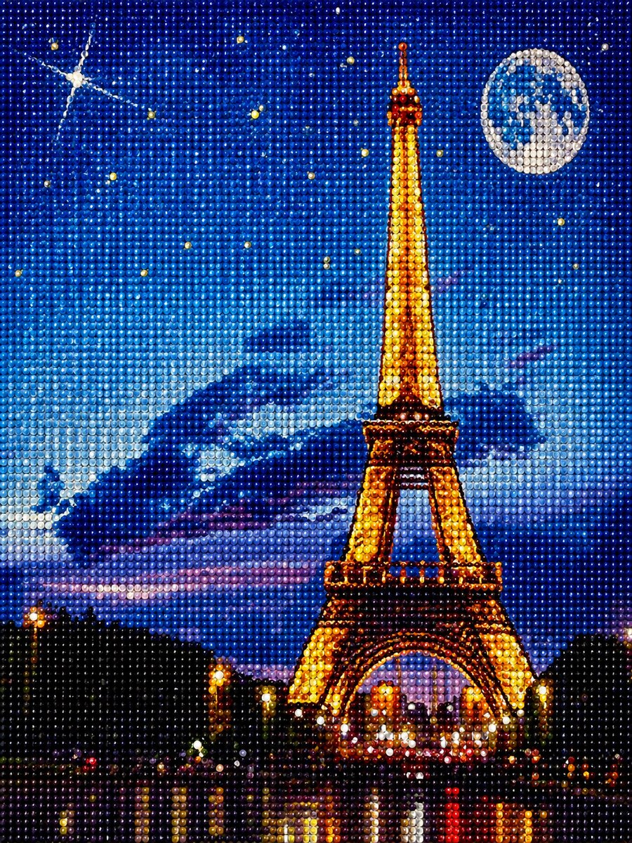 Finished Eiffel Tower diamond painting kit artwork lit up at night under a starry sky with a crescent moon | Azurra Shop