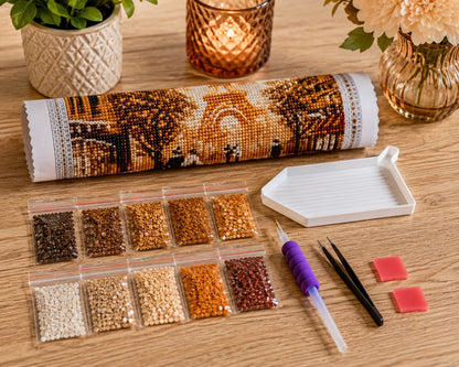 Diamond painting supplies laid out for the Eiffel Tower kit, including diamond packets, applicator pen, and tray | Azurra Shop