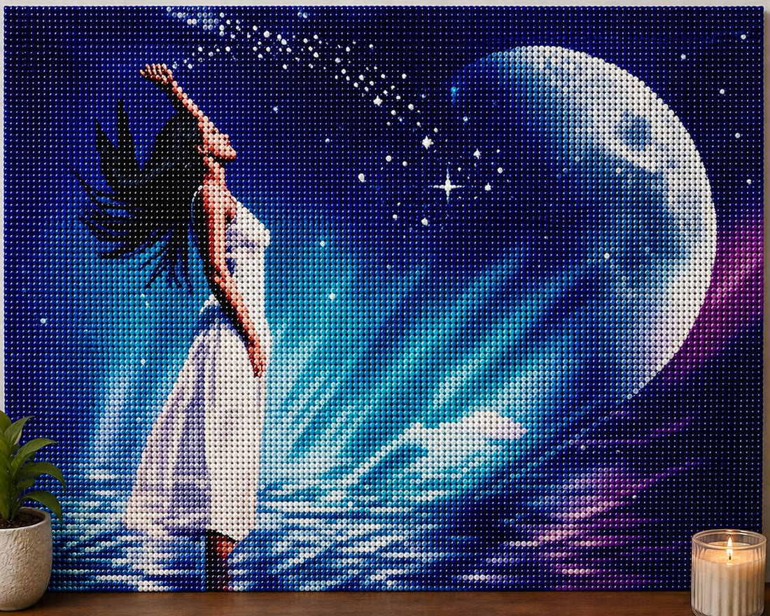 Finished ethereal moon goddess diamond painting with a woman in a flowing white dress reaching toward a glowing blue moon | Azurra Shop
