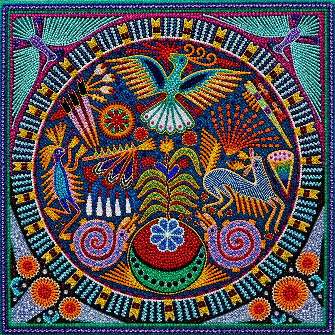 Finished Huichol folk art mandala diamond painting with a hummingbird, deer, peacock, and snails in a circular design on blue | Azurra Shop