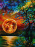 Finished golden harvest moon diamond painting with a glowing orange moon over water beside a colorful tree at sunset | Azurra Shop