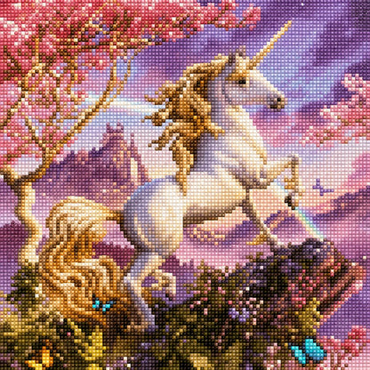 Finished golden mane unicorn diamond painting with a rearing unicorn under a pink cherry blossom tree against a purple sunset sky | Azurra Shop