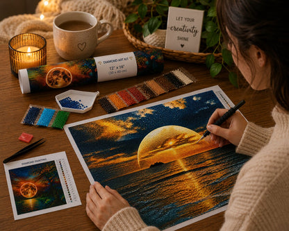 Woman placing diamonds on the golden moon rising over the sea canvas at a desk with coffee and a candle | Azurra Shop