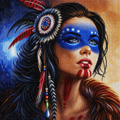 Finished diamond painting portrait of a Native American woman with blue face paint and a beaded feather headpiece | Azurra Shop