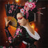 Close up of the finished Japanese geisha diamond painting holding a fan with cherry blossoms in her hair | Azurra Shop