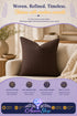 Brown woven accent pillow displayed on a beige sofa in a cozy living room setting