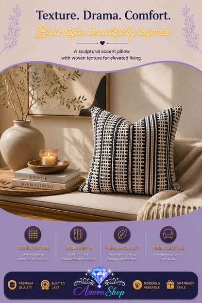 Black and ivory striped basketweave throw pillow styled on a woven bench beside candles and books
