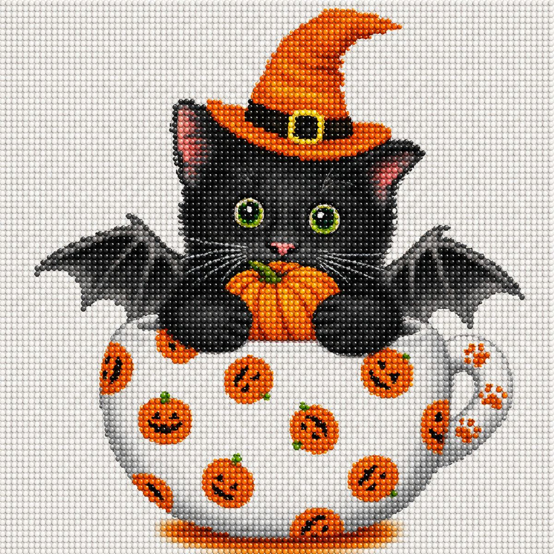 Close up of the finished black cat diamond painting wearing a witch hat and bat wings inside a jack o lantern teacup | Azurra Shop