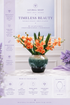 Orange Cymbidium orchid arrangement with film leaves in azure ceramic vase — Azurra Shop
