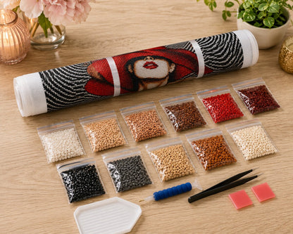 Rolled canvas and full supplies for the lady in red hat kit, including diamond bags, applicator pen, and tweezers | Azurra Shop