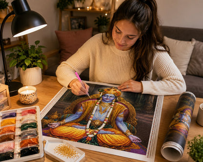 Working on the Lord Krishna kit at a cozy candlelit desk