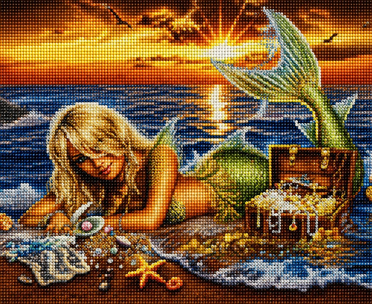 Finished mermaid and treasure chest diamond painting with a blonde mermaid lying on the beach beside jewels and a treasure chest at sunset | Azurra Shop