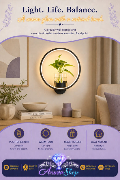 Black circular wall sconce with a built-in glass plant holder and a small potted green plant, mounted on a beige wall above a wooden console table, with a header graphic reading &
