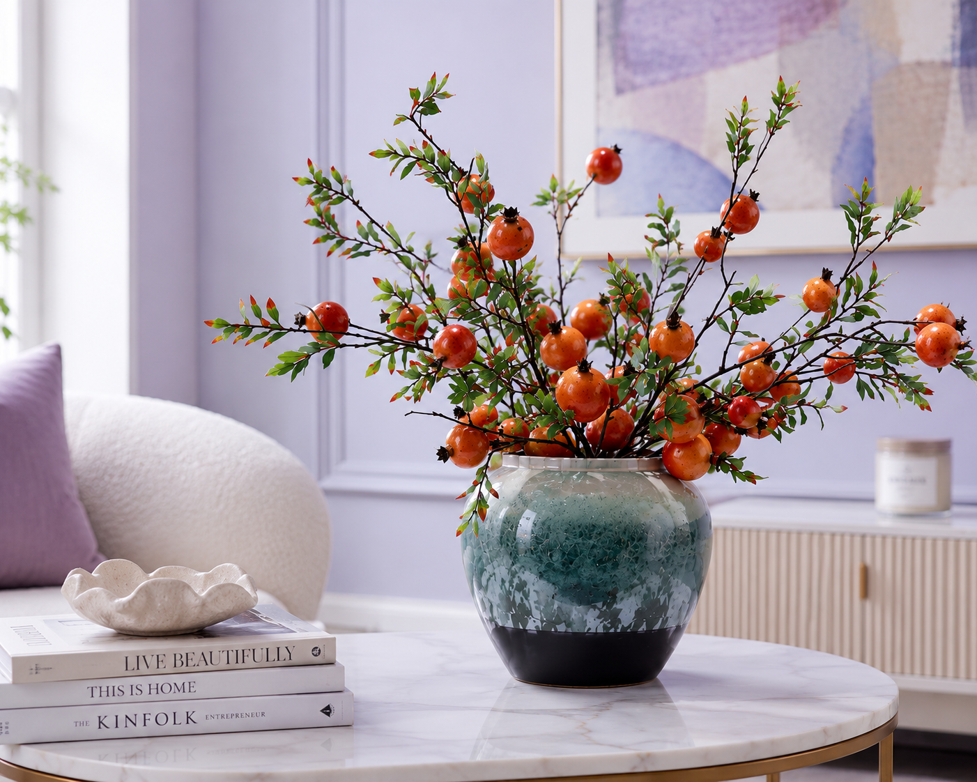 Orange pomegranate ceramic vase on marble coffee table in lavender living room — premium artificial floral decor — Azurra Shop
