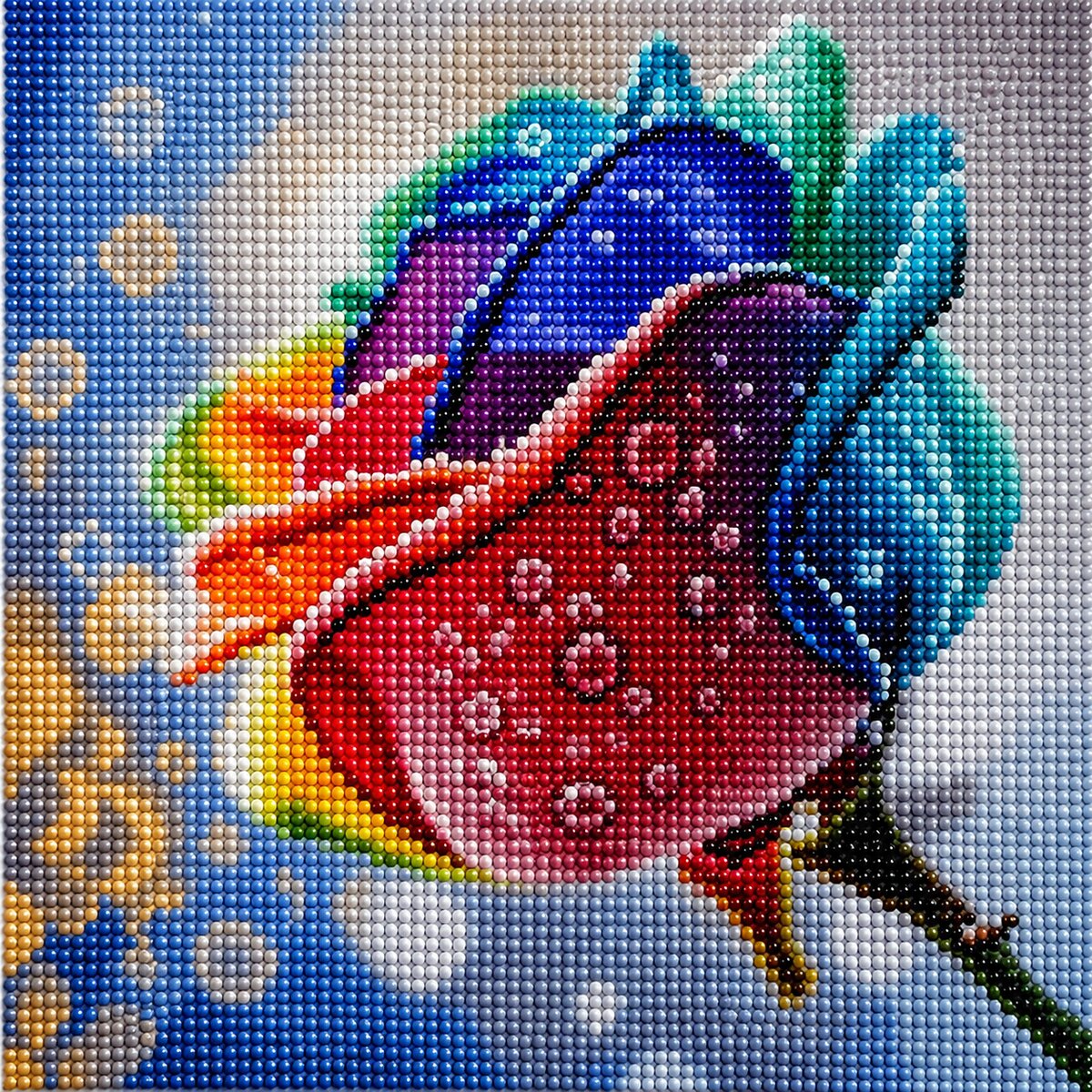 Finished rainbow rose diamond painting with a close up rose in blue purple orange and red petals with dew drops | Azurra Shop