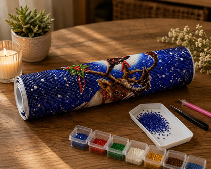 Rolled canvas and full supplies for the reindeer kit, including diamond trays, applicator pen, and tweezers | Azurra Shop