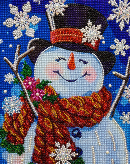 Close up of the finished crystal snowman diamond painting wearing a top hat and red scarf with sparkling snowflakes | Azurra Shop
