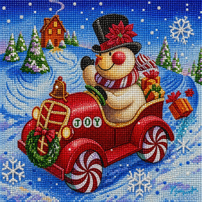 Close up of the finished snowman diamond painting driving a red JOY car loaded with gifts | Azurra Shop
