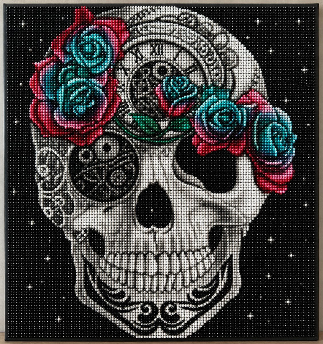 Close up of the finished steampunk sugar skull diamond painting with clock gears and teal and red roses | Azurra Shop