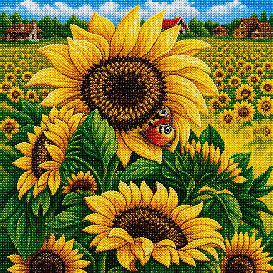 Finished sunflower field and butterfly diamond painting with large sunflowers, a butterfly, and a farm landscape background | Azurra Shop