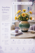 Golden sunflower and white daisy arrangement in cream to teal ombre glazed ceramic vase on marble table — Azurra Shop
