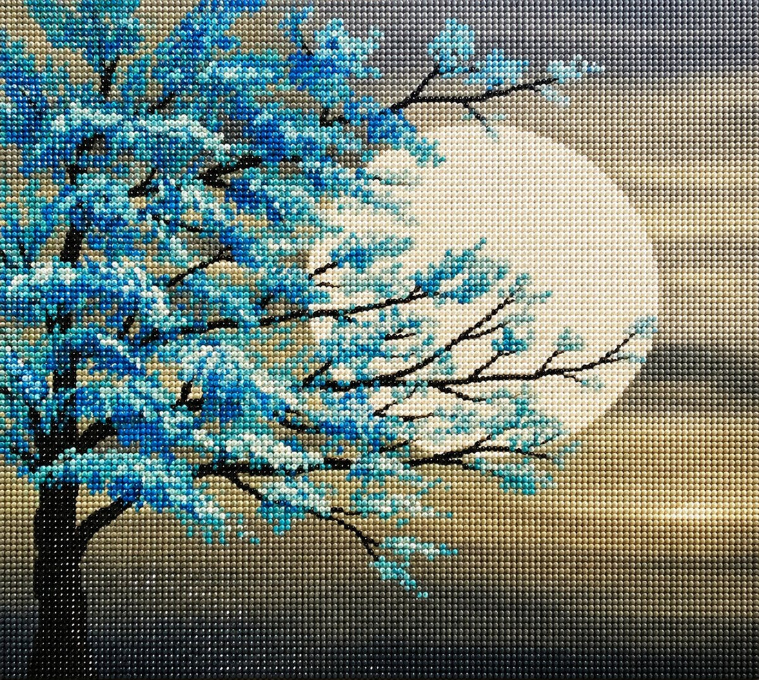 Finished teal cherry blossom moon diamond painting with a teal blossom tree silhouetted against a glowing full moon | Azurra Shop