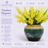 Yellow dancing Oncidium orchid arrangement with green iris leaves in reactive glaze gold to teal ceramic vase — Azurra Shop
