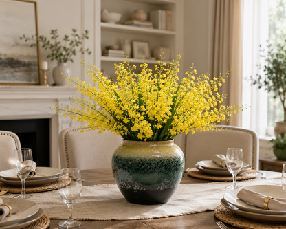 Yellow dancing orchid ceramic vase as dining table centerpiece in warm cream living and dining room — Azurra Shop
